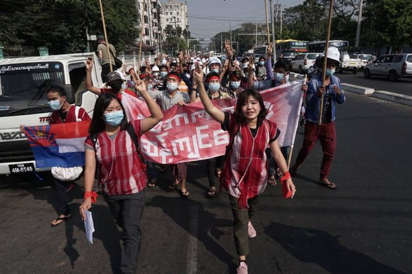 Protesters hold up the three-finger salute during a demonstration against the military coup in Yangon, on Feb 6, 2021. PHOTO: AFP